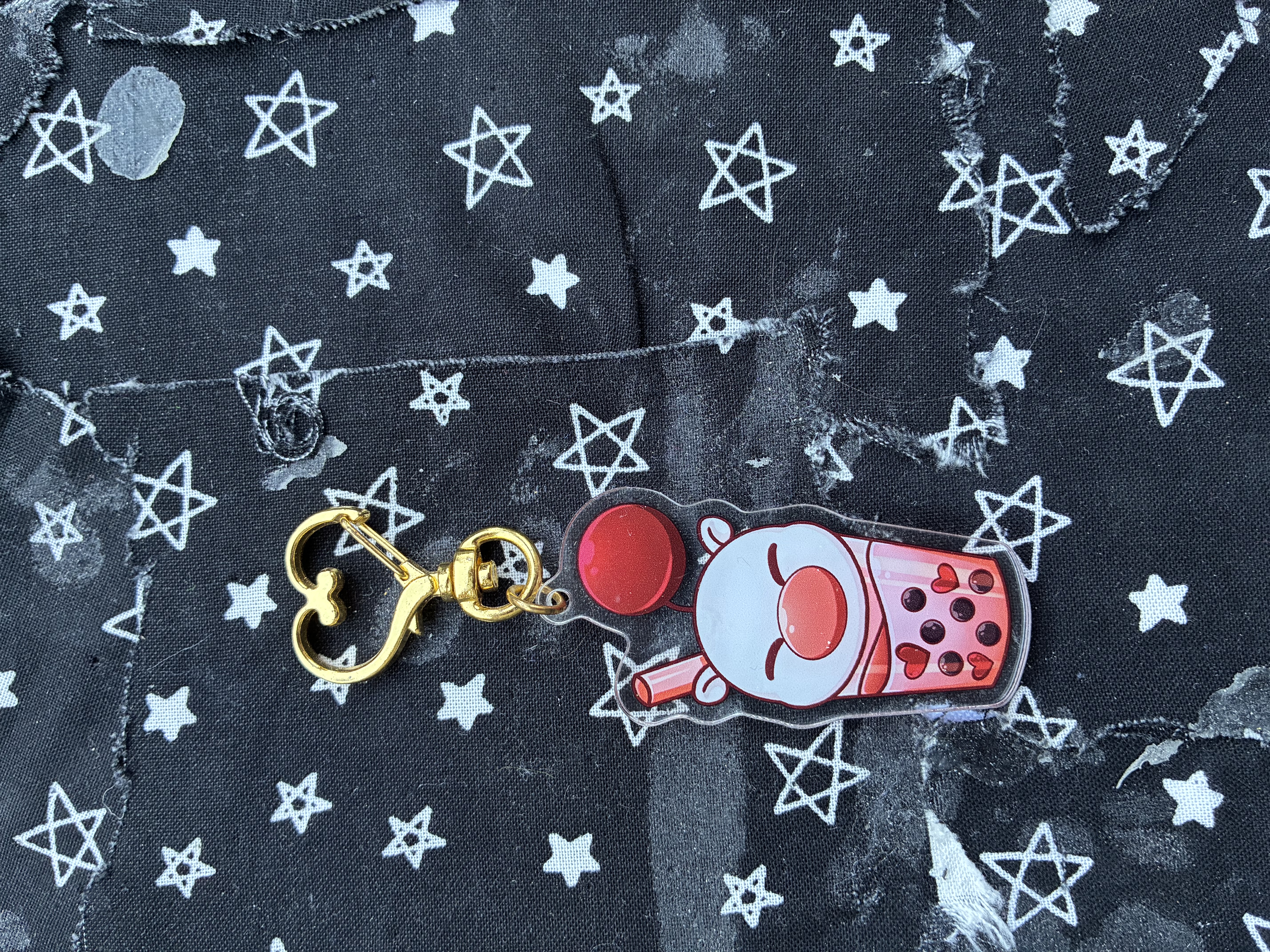Acrylic charm of a cup of boba shaped like a Final fantasy moogle.